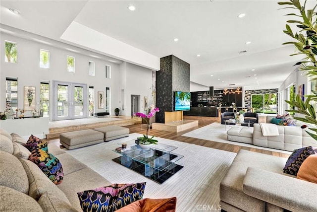 18782 Peppertree Dr, Villa Park, CA 92861 - living area with recessed lighting, wood finished floors, healthy amount of natural light, and french doors