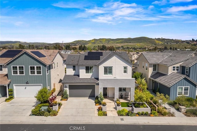32404 Old Sage Dr, San Juan Capistrano, CA 92675 - traditional home with concrete driveway, a residential view, an attached garage, and a mountain view