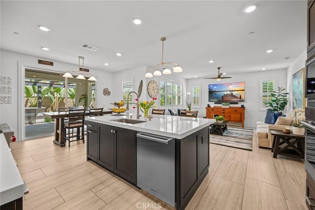 32404 Old Sage Dr, San Juan Capistrano, CA 92675 - kitchen with a sink, light countertops, stainless steel dishwasher, plenty of natural light, and recessed lighting