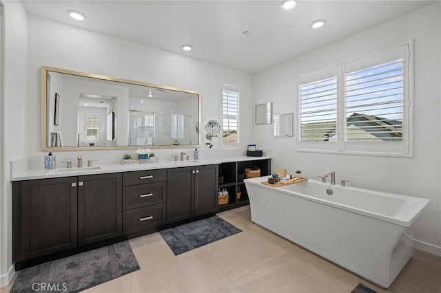 32404 Old Sage Dr, San Juan Capistrano, CA 92675 - full bath with a stall shower, double vanity, a freestanding bath, recessed lighting, and tile patterned floors