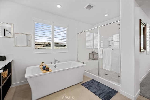 32404 Old Sage Dr, San Juan Capistrano, CA 92675 - full bathroom with plenty of natural light, a stall shower, a soaking tub, vanity, and recessed lighting