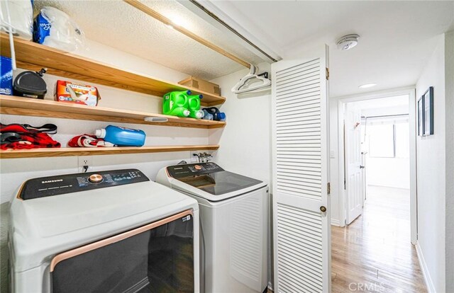 365 W Alameda Ave Unit 203, Burbank, CA 91506 - laundry area featuring separate washer and dryer and light wood finished floors