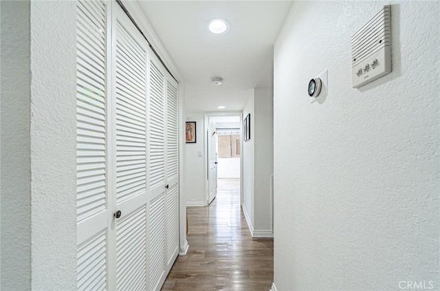 365 W Alameda Ave Unit 203, Burbank, CA 91506 - corridor featuring a textured wall, dark wood-style floors, baseboards, and recessed lighting