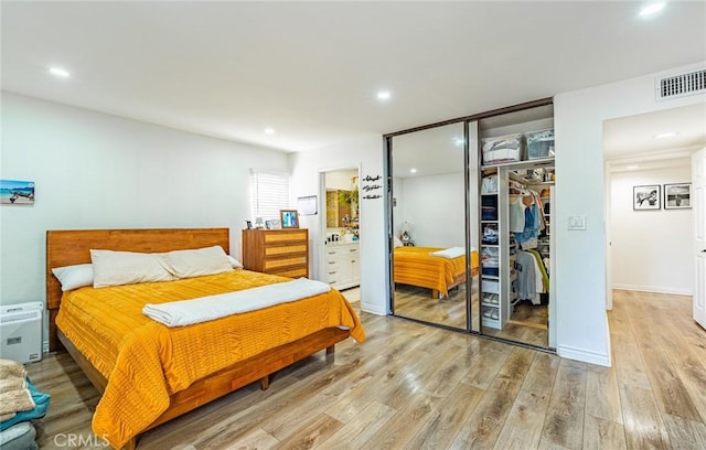 365 W Alameda Ave Unit 203, Burbank, CA 91506 - bedroom featuring a closet, light wood-type flooring, recessed lighting, and ensuite bath