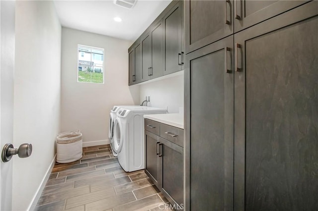 11837 Terra Vista Way, Sylmar, CA 91342 - clothes washing area with cabinet space, baseboards, washing machine and dryer, wood finish floors, and recessed lighting