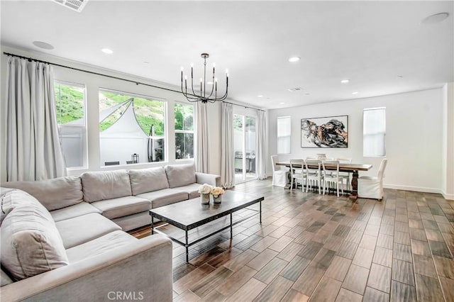 11837 Terra Vista Way, Sylmar, CA 91342 - living room with plenty of natural light, a chandelier, recessed lighting, baseboards, and wood finished floors