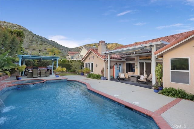 24632 Stagg St, West Hills, CA 91304 - view of pool with an outdoor living space, a patio, a mountain view, and a pool with connected hot tub