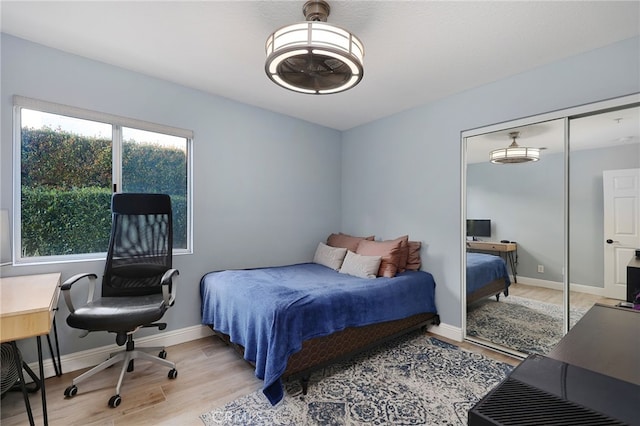 24632 Stagg St, West Hills, CA 91304 - bedroom with light wood-type flooring, a desk, and a closet