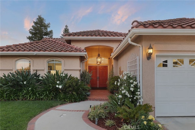 24632 Stagg St, West Hills, CA 91304 - entrance to property with a garage, stucco siding, and a tile roof