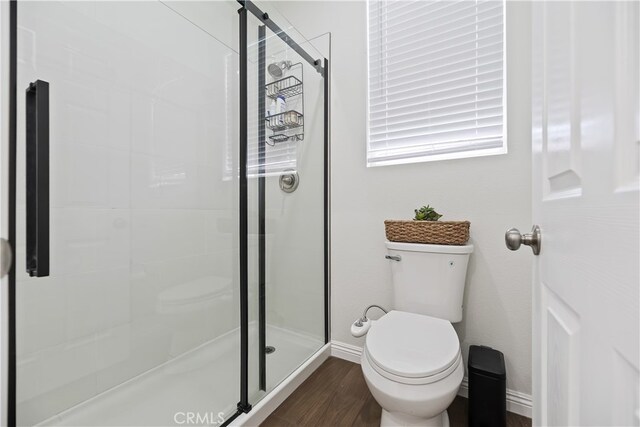 23900 Vista Way, Menifee, CA 92587 - full bath with toilet, a stall shower, wood finished floors, and baseboards