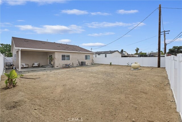 23900 Vista Way, Menifee, CA 92587 - back of property featuring cooling unit, a patio area, a fenced backyard, and stucco siding