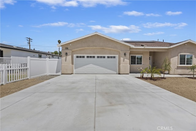 23900 Vista Way, Menifee, CA 92587 - single story home with stucco siding, a garage, driveway, and solar panels
