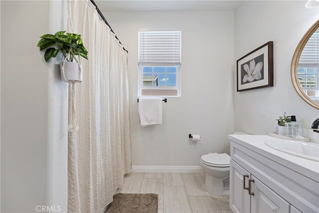 23900 Vista Way, Menifee, CA 92587 - full bathroom with toilet, healthy amount of natural light, vanity, and baseboards