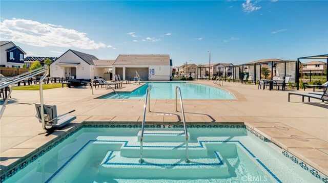 30051 Sunset Pier Dr, Menifee, CA 92584 - community pool featuring a community hot tub, a residential view, and a patio area