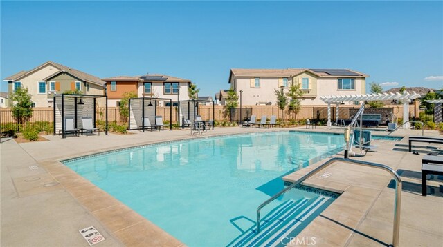 30051 Sunset Pier Dr, Menifee, CA 92584 - community pool featuring a pergola, a residential view, fence, and a patio