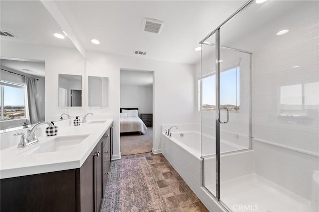 11475 Sheridan Way, Beaumont, CA 92223 - ensuite bathroom featuring a shower stall, double vanity, recessed lighting, and a bath