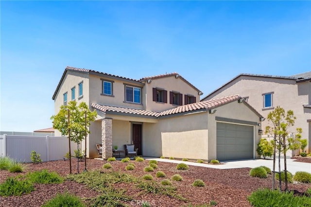 11475 Sheridan Way, Beaumont, CA 92223 - mediterranean / spanish house with fence, a garage, stucco siding, a tiled roof, and concrete driveway