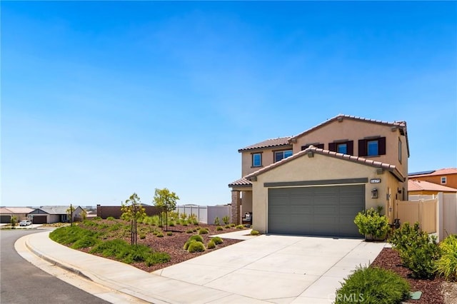 11475 Sheridan Way, Beaumont, CA 92223 - mediterranean / spanish-style house with fence, stucco siding, an attached garage, concrete driveway, and a tile roof