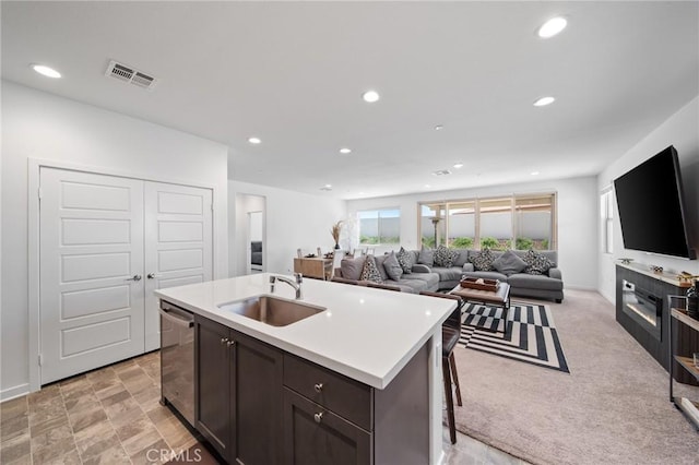 11475 Sheridan Way, Beaumont, CA 92223 - kitchen featuring a sink, dishwasher, recessed lighting, light countertops, and an island with sink