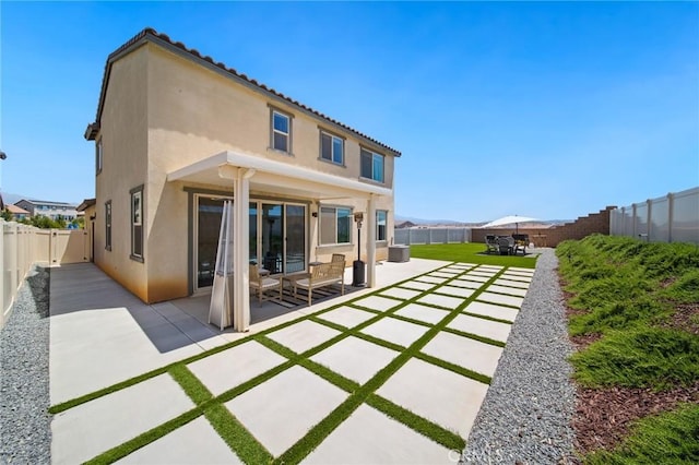 11475 Sheridan Way, Beaumont, CA 92223 - rear view of house featuring a patio, a fenced backyard, and stucco siding