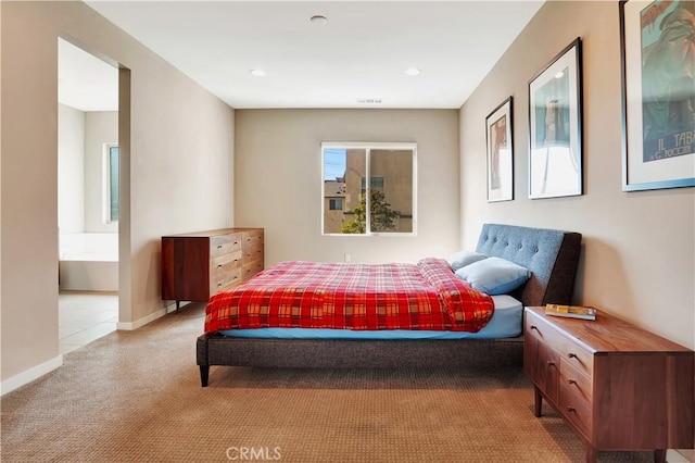 1508 W Artesia Unit H, Gardena, CA 90248 - bedroom featuring light colored carpet, ensuite bath, and baseboards