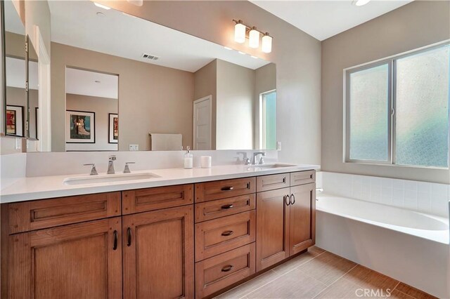 1508 W Artesia Unit H, Gardena, CA 90248 - full bathroom with a bath, double vanity, and tile patterned floors