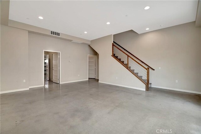 1508 W Artesia Unit H, Gardena, CA 90248 - unfurnished living room featuring finished concrete flooring, baseboards, stairway, and recessed lighting