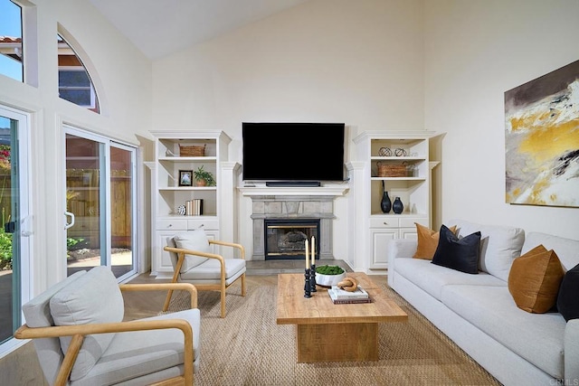 2935 Via Emerado, Carlsbad, CA 92009 - living room featuring wood finished floors, a glass covered fireplace, high vaulted ceiling, and healthy amount of natural light
