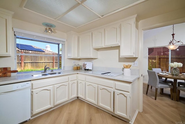 2935 Via Emerado, Carlsbad, CA 92009 - kitchen with white appliances, a sink, light wood-type flooring, white cabinetry, and light countertops