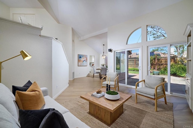 2935 Via Emerado, Carlsbad, CA 92009 - living area featuring a high ceiling, wood finished floors, and baseboards