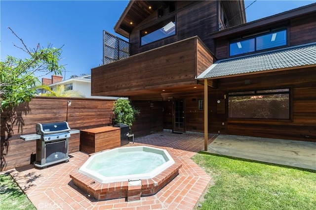 2405 Tustin Ave, Costa Mesa, CA 92627 - view of patio featuring an outdoor hot tub, grilling area, and fence