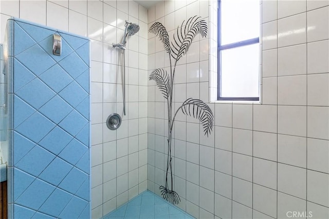 full bath with a tile shower