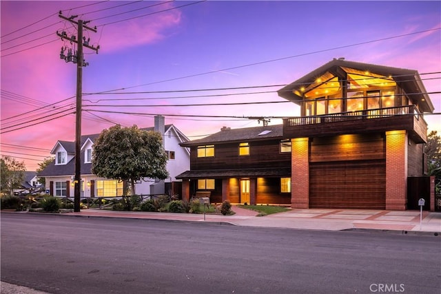 view of front of home with a balcony