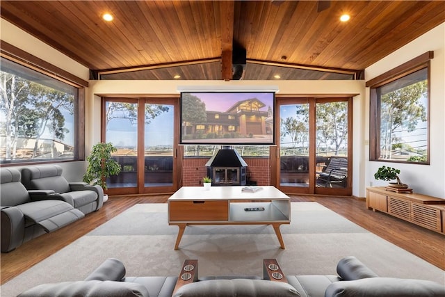 sunroom / solarium with healthy amount of natural light, a wood stove, and french doors