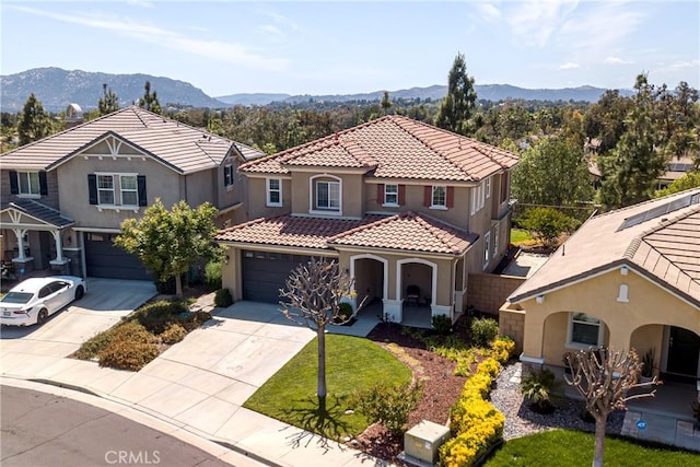 43075 Beamer Ct, Temecula, CA 92592 - mediterranean / spanish home with stucco siding, driveway, a tiled roof, and a mountain view