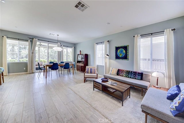 43075 Beamer Ct, Temecula, CA 92592 - living area featuring light wood-type flooring and baseboards