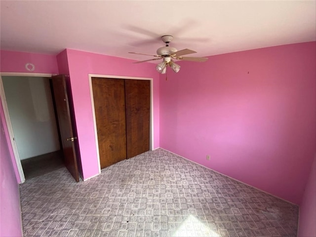 unfurnished bedroom with carpet flooring, a closet, and ceiling fan