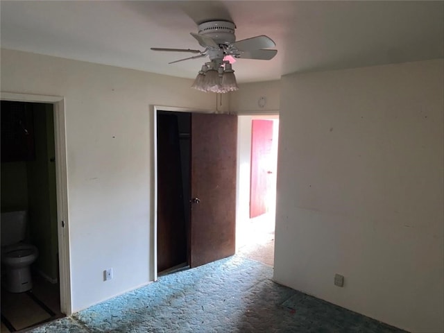 unfurnished bedroom with carpet, a closet, and a ceiling fan