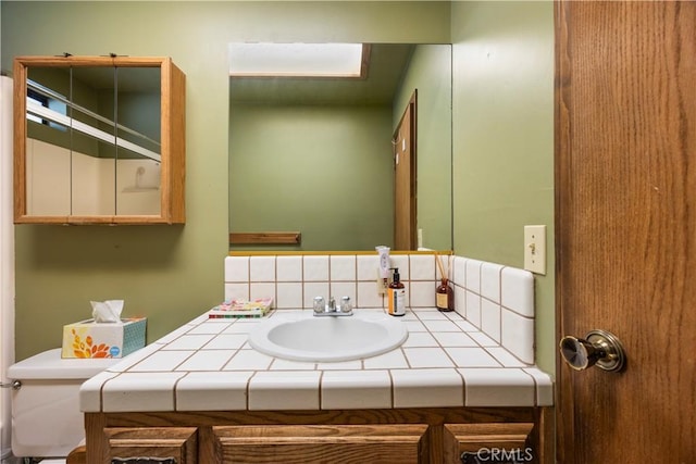 2513 Arbor Dr, Pine Mountain Club, CA 93225 - bathroom with backsplash, vanity, and toilet