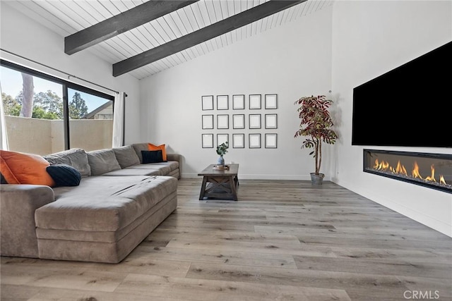 2514 N Tustin Ave Unit 71, Santa Ana, CA 92705 - living room with a glass covered fireplace, wood finished floors, beam ceiling, high vaulted ceiling, and wooden ceiling