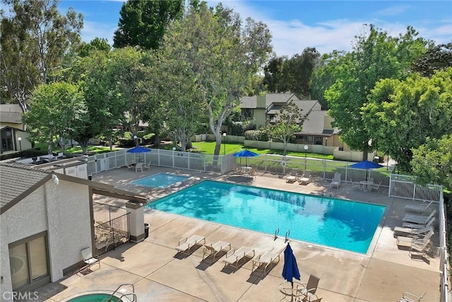 2514 N Tustin Ave Unit 71, Santa Ana, CA 92705 - community pool with fence, a patio, and view of wooded area