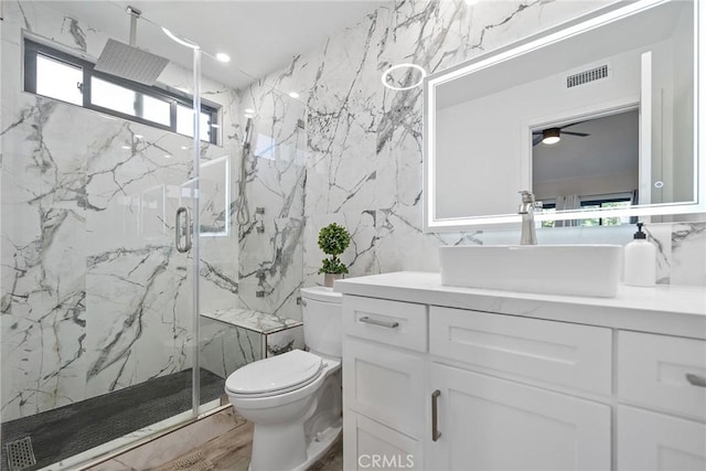 2514 N Tustin Ave Unit 71, Santa Ana, CA 92705 - bathroom with tile walls, toilet, a marble finish shower, vanity, and ceiling fan