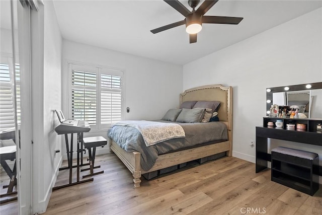 2514 N Tustin Ave Unit 71, Santa Ana, CA 92705 - bedroom featuring light wood-style floors, baseboards, and a ceiling fan