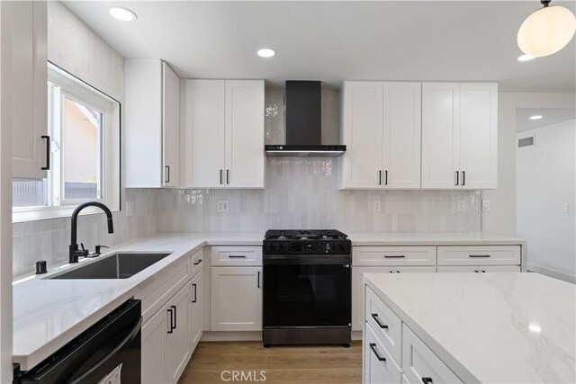 2514 S Rita Way, Santa Ana, CA 92704 - kitchen featuring black appliances, wall chimney exhaust hood, a sink, light stone countertops, and recessed lighting