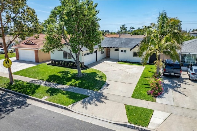 2514 S Rita Way, Santa Ana, CA 92704 - ranch-style house featuring driveway, a front yard, stucco siding, and an attached garage
