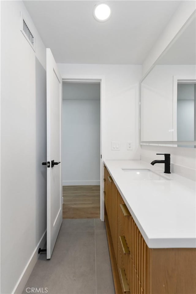 2514 S Rita Way, Santa Ana, CA 92704 - bathroom with baseboards, vanity, and tile patterned flooring