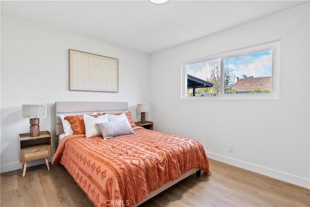 2514 S Rita Way, Santa Ana, CA 92704 - bedroom with baseboards and wood finished floors