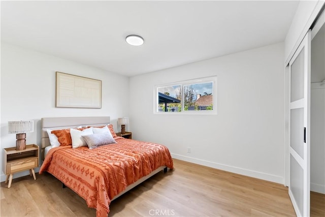 2514 S Rita Way, Santa Ana, CA 92704 - bedroom with light wood-style floors and baseboards