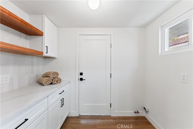 2514 S Rita Way, Santa Ana, CA 92704 - laundry area featuring light wood-style flooring and baseboards