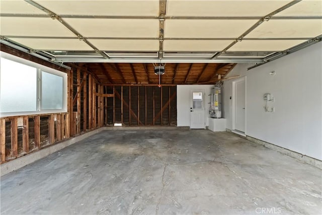 2514 S Rita Way, Santa Ana, CA 92704 - garage with strapped water heater and a garage door opener